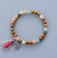 Handmade Elastic Mala Bead Yoga Bracelet featuring Boho Natural Stones, Pyrite, and Tassel accents.